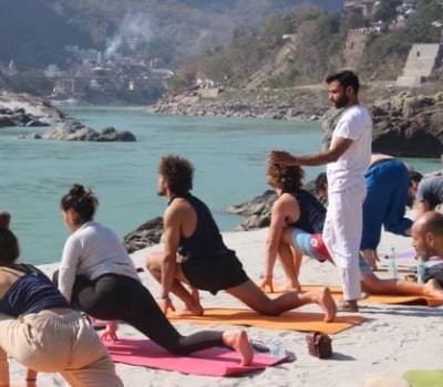 Beach yoga practice during training