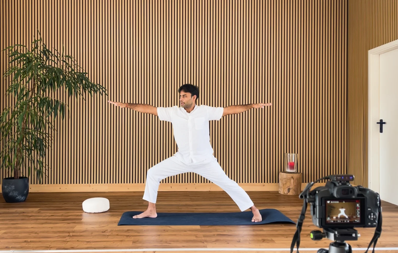 Live online yoga class displayed on a tablet at home